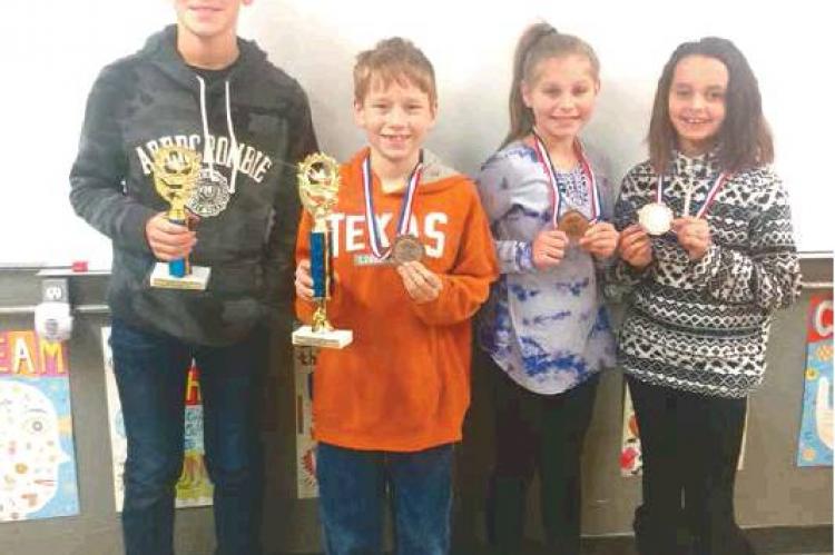 THE STUART ELEMENTARY SCHOLASTIC TEAM recently competed in the Justice School Scholastic Meet. Winners from Stuart Elementary were: Zach Luker- 2nd place in 5th grade Reading; AJ Stephens- 1st place in 4th grade Social Studies & 4th place in 4th gra Article Image Alt Text