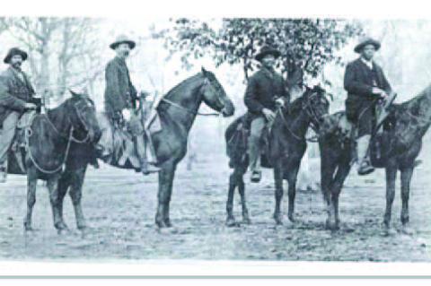 Deputy U.S. Marshal Robert Fortune, far right, is seen circa 1900 in Indian Territory during a search for fugitives. Fortune went on to distinguis himself as a civil rights attorney in Oklahoma and Arizona. He is seen here with Amos Maytubby, left, a Cree