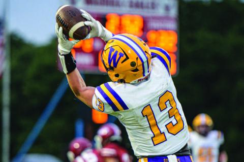 Bryant Sites leaps to catch a pass from Quarterback Isaiah Drake.