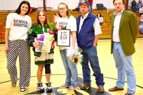 Senior Destiny Smith was escorted by her parents, Terrae and Paul Smith and sister Shirrae Duncan. Girls coach Brandon Kirkpatrick made the presentation.