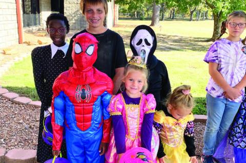 Liam Foster, Hadley Stafford, Azari Stafford. Back: Jalynne Fos - ter, Conner Foster, and Codah Stafford filled up their buckets full of candy this year at WWTC Halloween.