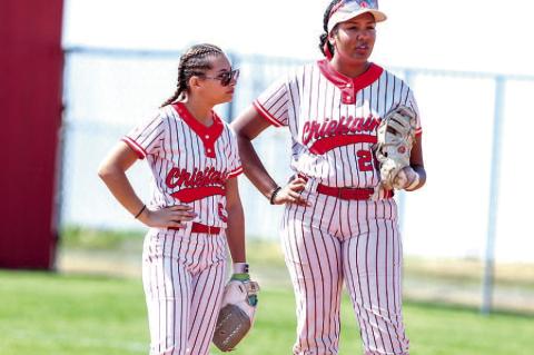 Wetumka Seniors Raylen Blackshire and Diamond Hobia strategize between innings