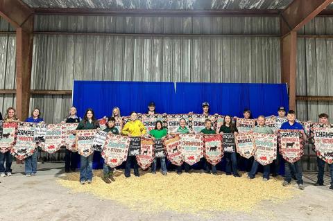 HUGHES COUNTY JUNIOR LIVESTOCK SHOW Pictured are many of the banner winners from the Moss 4H &amp; FFA Show Team at the Hughes County Junior Livestock Show Premium Sale held on Tuesday, Feb 25, 2025. Front row: Cierra Wood, Samuel Pipkin, Jaxi Long, Lexi 