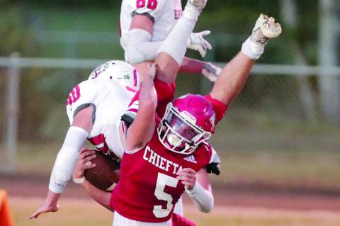 #5 Zane Jaggars upends an Empire runner Football Photos by Dane Smart
