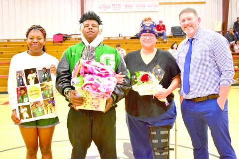 Eldon Heneha was escorted by his aunt Mattie Looney and his sister Nyah Heneha. Coach Steve Corn made the presentation