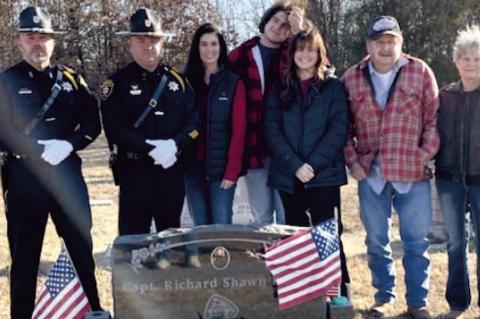 Officers from the McAlester Police Department along with family members of Captain Richard Parker gathered at Wetumka Cemetary recently to place a wreath on the hero's grave. Pictured above are (L-R): Master Patrolman Nick Mattioda, Sergeant Kevin Bishop,