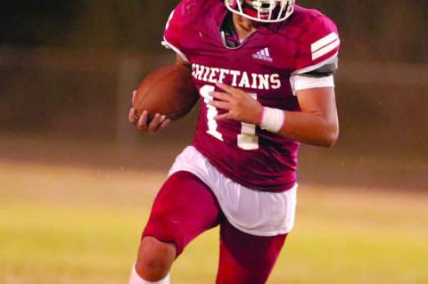 Dwayne Lowe drives the ball up the field.