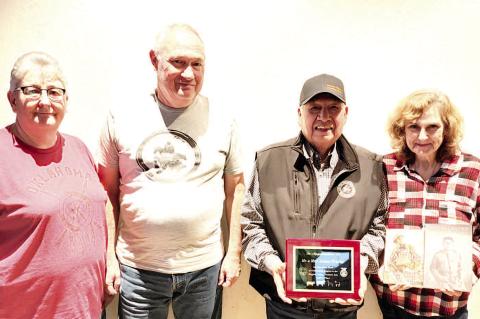 Choctaw Tribal Councilman District 12, Mr. James Frazier and his lively wife Vicki were presented with a plaque for their many years of support to the Hughes County Premium Sale. 2025 will be James and Vic- ki's final year to attend as he will be retiring