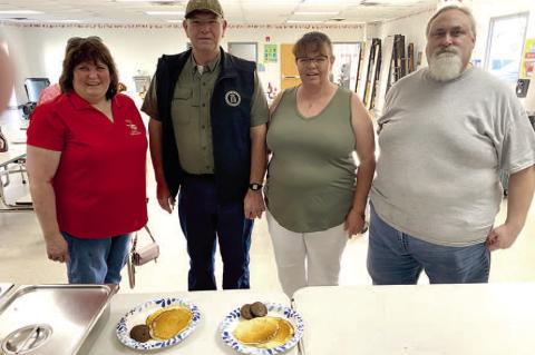 Donna Dyer (left) and Jason Tyler (right) were thrilled to wel - come State Representative David Smith and his wife Teresa (center).