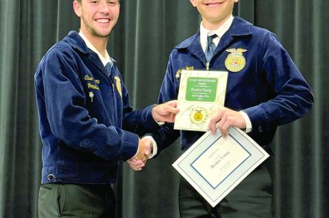FFA President Cason Crump presenting Bradyn Young with the “Star Greenhand” award. Photos courtesy of Kassie Ingle ~ Additional photo on page 2